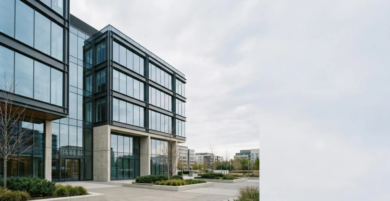 Modern commercial office building exterior with clean architecture representing pension property investment concept